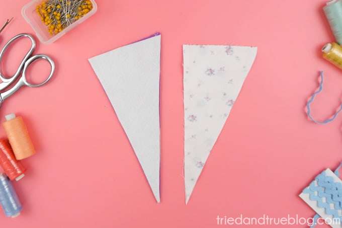 Sew fabrics together to make a triangular pouch
